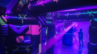 Kid playing laser tag onboard Symphony of the Seas
